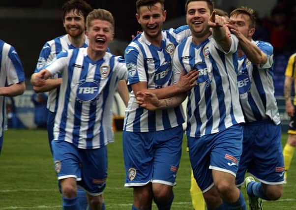 What a goal , , , James McLaughlin is chased by his Coleraine team-mates as they celebrate his wonder goal against Dungannon Swifts at the Showgrounds on Saturday. wk43068mb