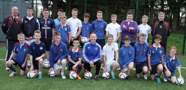 FUT IT THERE. Jonathan Michael (front centre), IFA Futsal Manager, pictured along with pupils from Dalriada along with football coaches Ian Getty and Paul Gaston on Monday.INBM43-15 002SC.