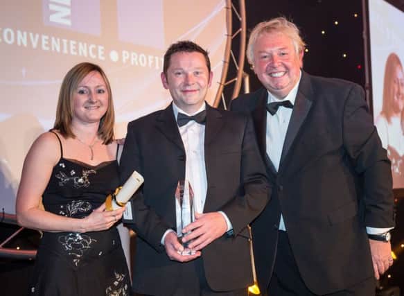 Timothy Walsh of Walsh's Newsagents receiving his Magazine Retailer of the Year at the prestigious NFRN Awards.
