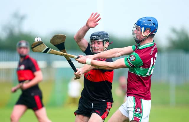 Naomh Colums' Chris Cross and Eoghan Ruas' Ruairi Mooney in action during the Quarter Final at O'Neill Park in Dungannon. Picture - Kevin Scott / Presseye