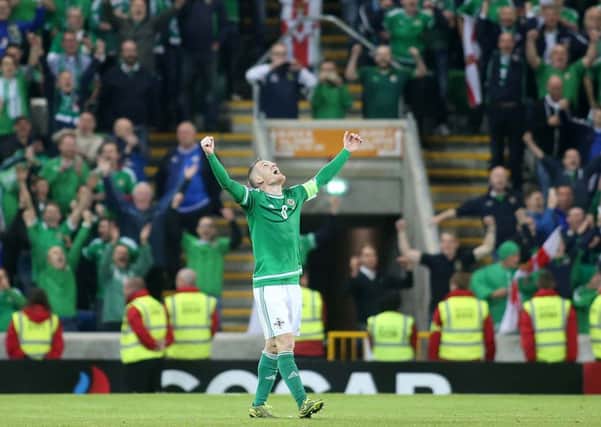 Press Eye - Belfast - Northern Ireland - 8th October 2015

Euro 2016 Qualifier - Northern Ireland Vs  Greece at Windsor Park, Belfast.  Northern Ireland's captain Steven Davis celebrates after they win 3-1 and qualify for the finals in France. 

Picture by Jonathan Porter/PressEye