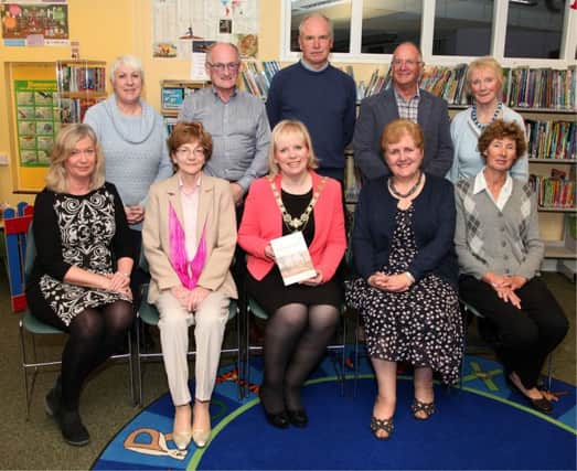 Councillor Michelle Knight-McQuillan, Coleraine Mayor, and Editor Jennifer Cunningham, BEM, pictured with contributors at the launch of the new Bann Disc at Coleraine Library on Wednesday evening. INCR44-301PL