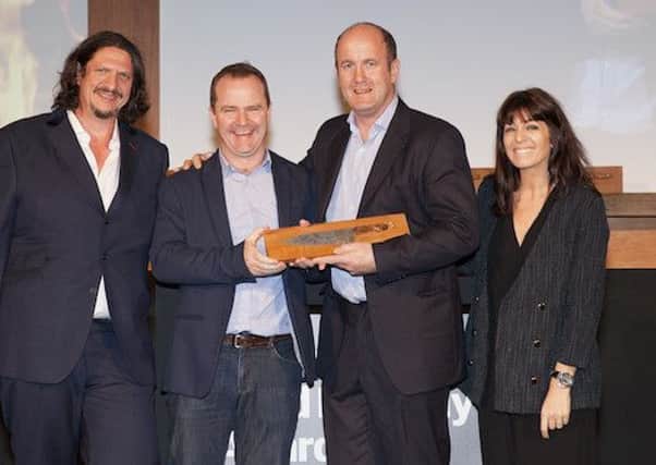 Observer restaurant critic Jay Rayner and Claudia Winkleman present the Best newcomer in food and drink award to Harry's Shack at the Observer Food Awards 2015, held at Freemasons Hall in London, 15 October 2015. Photograph Alicia Canter for the Observer