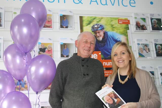 Ian Meehan, 67, from Banbridge and Age NI advisor Eibhlin Collins celebrate the launch of a new drop-in advice service that is being piloted in the charitys store at 13 Rathfriland Street, every Wednesday from 10am to 1pm.