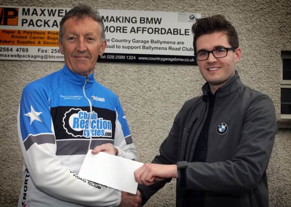 Jack Jenkins, BMW Genius from The Country Garage, presents a sponsorship cheque to Jim Burns, of Ballymena Road Club. INBT39-216AC