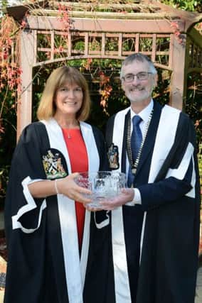 Dr Fannin receives her award from Chair of RCGPNI, Dr John OKelly. inbm43-15 s