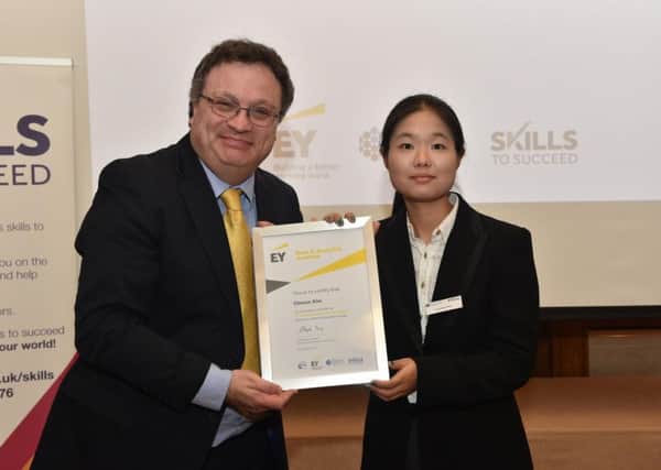 Choeun Kim receiving her certificate from Minister Farry at the EY Data and Analytics Academy graduation. INNT 43-821CON