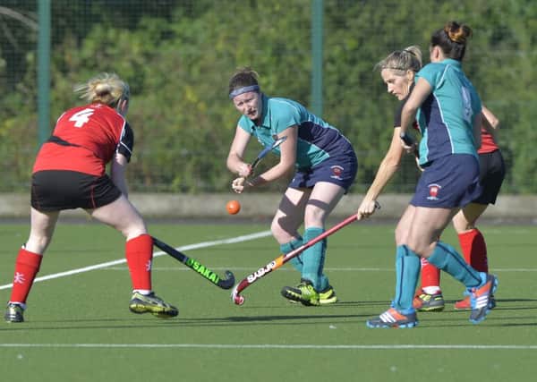 Emma Nichols (centre) battles for possession of the ball in the 3-0 win over Limavady. INLT 43-912-CON Photo: Presseye