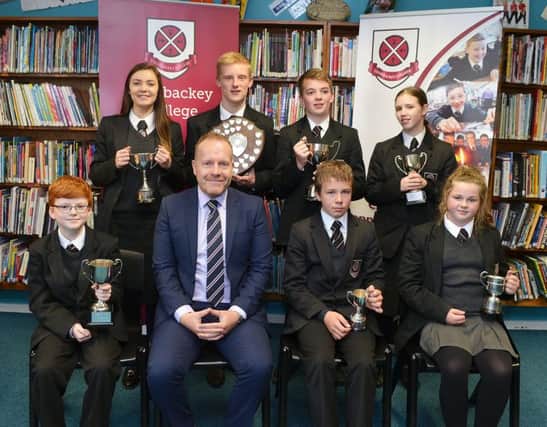 Cullybackey College students with their awards for music and sport photographed with Mr Donaldson, principal.  INBT 44-805H