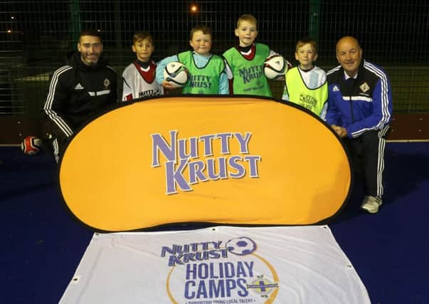 IFA Primary School coach Mo McDowell (left) and IFA Primary Schools co-ordinator Ian Getty with young footballers Kaan, Kain, Charlie and Cillian at the launch of the Nutty Krust Halloween Camp which will be held at the Ballymena Showgrounds. INBT 43-170CS