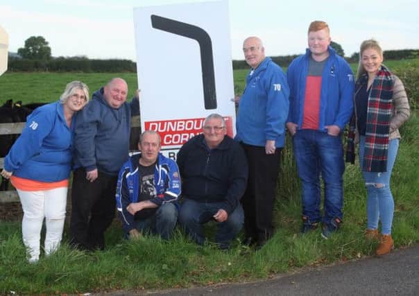 Family and friends of Victor Gilmore at the corner of the Clough circuit that is to bear his name.From left: Victor's sister Jodie-Linda, brother Jonathan, Davy McCartney and Wesley Grace of the Mid Antrim motorcycle club. Victor's father Jim and son and daughter Craig and Jodie. Picture: Roy Adams.