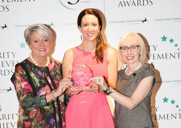 Kerry Boyd, Director of Development at Autism NI (centre) with Dr Claire Hughes, a parent and Autism NI branch chairperson along with Sandara Kelso-Robb, Executive Director Lloyds Bank Foundation for Northern Ireland.