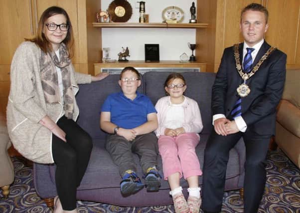 Mayor of Antrim and Newtownabbey, Councillor Thomas Hogg, with Tomas, Ella and their mum Kerri in the Mayor's Parlour at Mossley Mill. INNT 43-829CON