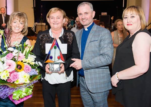 Ardboe Parish Person of the Year Award winner Eithne Quinn with Dympna McAuley, Fr. Sean McCartan and Deirdre Mayo