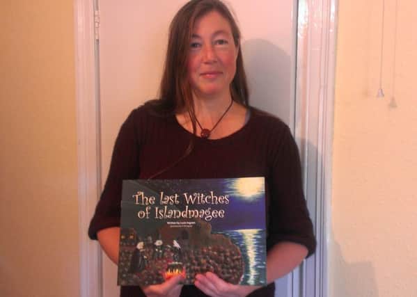 Luan Ingram with her novel The Last Witches of Islandmagee. INLT-44-706-con