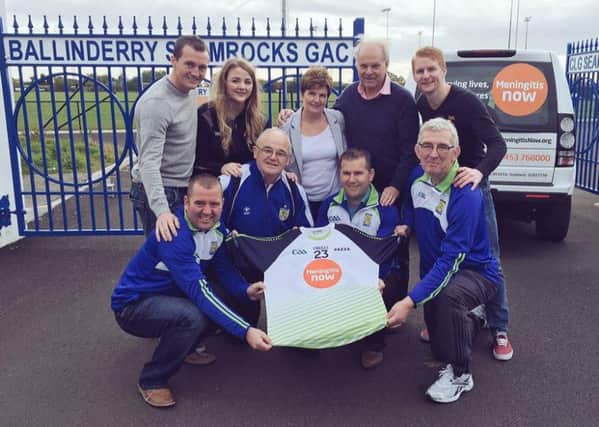 Carmel, Ronan, Coilin and Anna Devlin unveil Aaron's jersey with help from Menigitis Now co-founder Steve Dayman and Ballinderry Shamrocks members