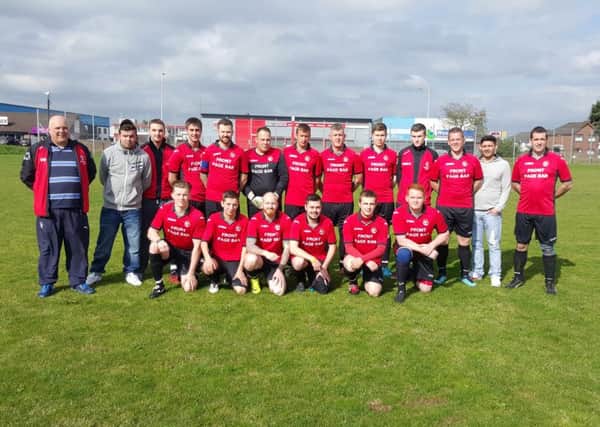 Woodside FC pictured in their new kit, sponsored by the Front Page bar.