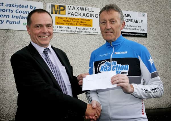 James Burns of Ballymena Road Club is pictured receiving a sponsorship cheque from Gary Byers of Maxwell Packaging. INBT39-214AC