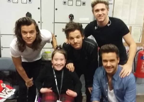 Katie Millar is pictured meeting her idols One Direction. INLT-44-710-con