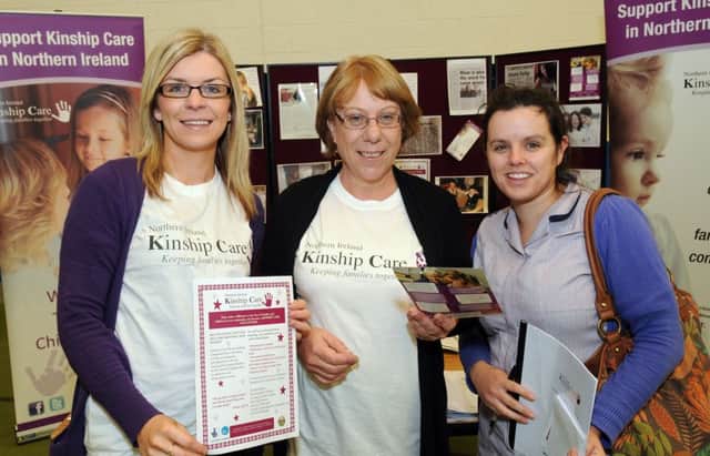 Michelle McGrath, from Cookstown (right) chatting with Michelle Dixon and Ali McAllister, from, Kinship Care, at their stand at the Volunteer Recruitment Fair held at Meadowbank Sports Arena, Magherafelt. INMM4213-105ar.