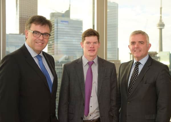 Robert Johnston of Enterprise Stationery Ltd is pictured in Toronto with Enterprise Minister, Jonathan Bell, who is leading a trade mission to Canada this week and Invest Northern Ireland CEO, Alastair Hamilton. The Lurgan based firm manufactures custom printed document filing stationery.