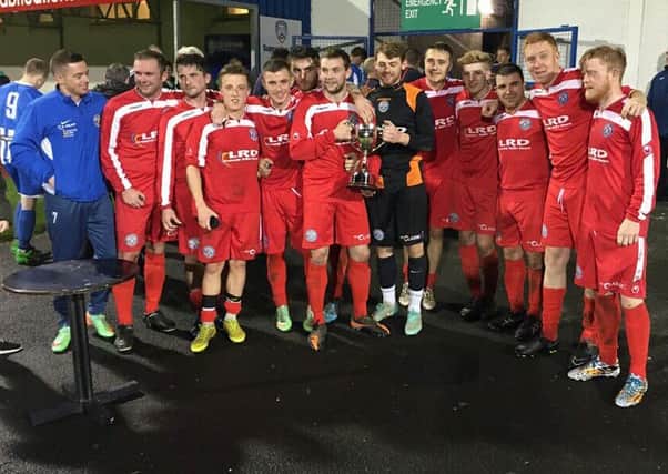 Limavady United player manager Paul Owens (far left) celebrates with his team after their North West Senior Cup final win over Coleraine.