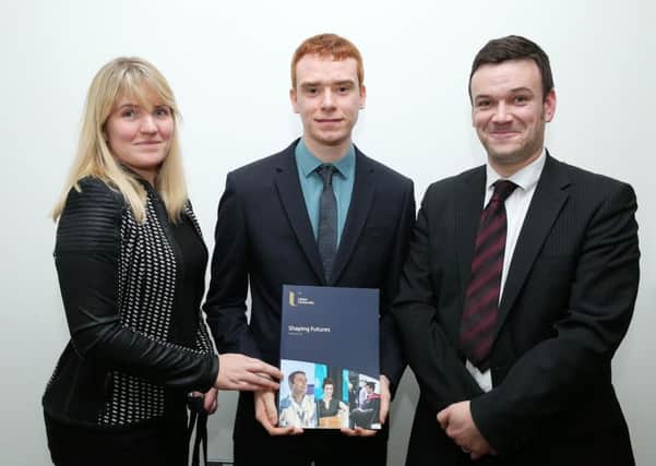 Award winner Jordan McCord (centre) is pictured with Sarah McKeag of sponsors EY and Ulster University Business School lecturer Mark Mulgrew.