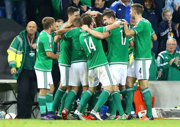 Northern Ireland players celebrate scoring against Greece during their Euro 2016 qualifier.  INCT 42-903-CON  Photo: Presseye