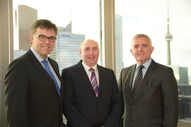 David Simms of Yelo (centre) is pictured in Toronto with Enterprise Minister Jonathan Bell (right) and Alastair Hamilton, Invest Northern Ireland CEO. INCT 43-799-CON