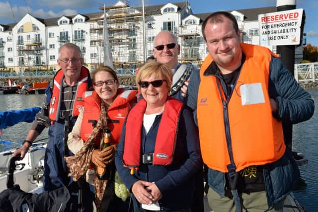 Kevin Johnston (left), Belfast Lough Sailability volunteer, his wife Marion (2nd left) and son Stephen (right) with Anne Taylor, chair of BLS and the Mayor of Mid and East Antrim Borough Council, Councillor Billy Ashe. INCT 42-002-PSB