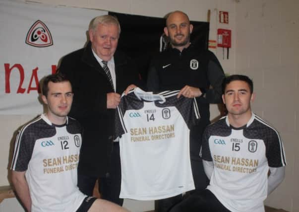 The Under 21 footballers of All Saints GAC will be well kitted out following a generous donation of jerseys by local Funeral Director, Sean Hasson. Pictured with Mr Hasson are Peter McCann (Team Selector) and U21 players Phelim Killough and Diarmuid McNally.