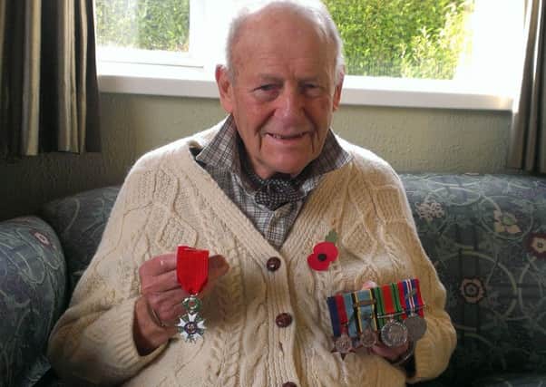 Frank Ferguson with his new Legion d'Honneur medal (left) and his four World War 2 campaign medals (right). INLT-45-704-VL