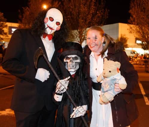 Jonathan and Jason Glenn with Naomi Norwood in their spooky Halloween fancy dress outfits.