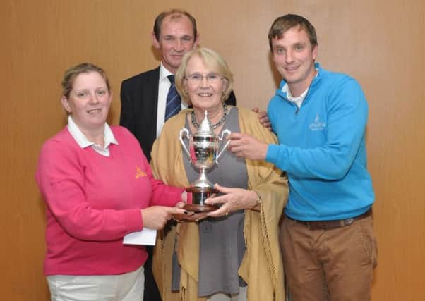 Family and friends of the Arthur family recently presented a perpetual trophy, the Adam Arthur Cup, in memory of their father. His son George Arthur, who has followed in his footsteps as captain presented the trophy, along with his mother to Mr D McKee and Mrs L McMeekin.