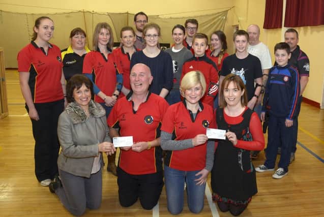 On behalf of Banbridge Archery Club Suzanne Barlow and Seamus McGreevy presented £1000:00 cheques, proceeds from the clubs' recent charity shoots, to Dr Michelle Hollywood towards the Renal Unit in Daisy Hill Hospital and Wendy MacAulay towards the Northern Ireland Children's Hospice ©Edward Byrne Photography INBL1544-210EB