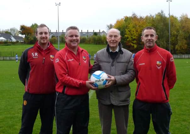 Banbridge Town B Under-17s receive a sponsored match ball from the club's loyal supporter Harry Dennison.