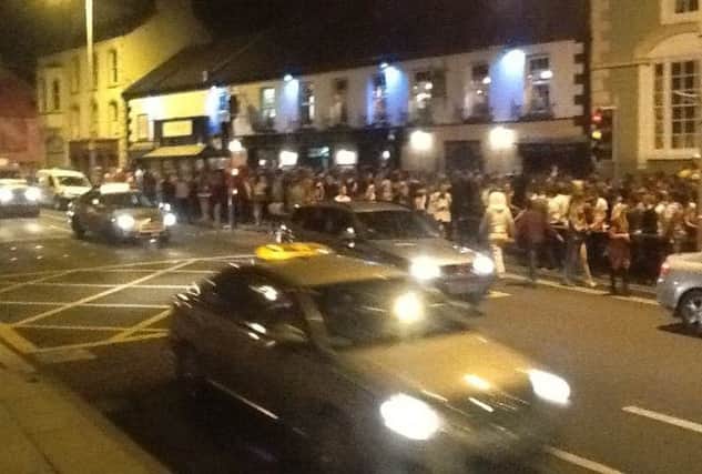 The scene outside the Coach on Saturday night as hundreds of people crammed into the street.