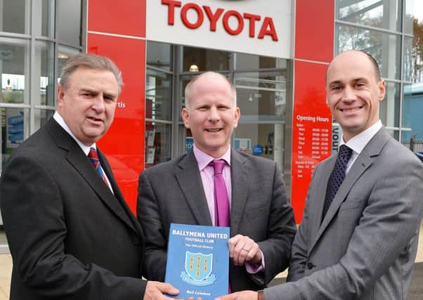 Ballymena United Sales and Marketing Executive Brian Thompson presents one of two signed copies of the new club history to Matthew Porter and Stephen Smyth (Sales Manager) of Curtis Toyota, Ballymena, for a forthcoming competition. The dealership are sponsoring this Saturdays game against Glentoran. INBT 45-804H