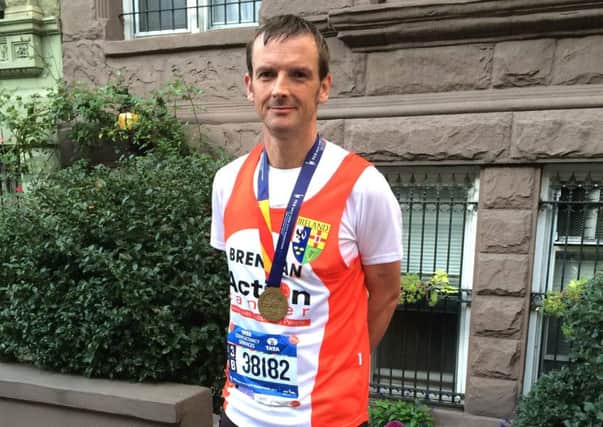 Newtownabbey man Brendan McGeown completed the New York City Marathon to raise funds for Action Cancer. INNT 45-597CON