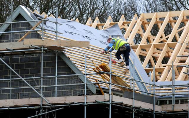File photo dated 28/02/12 of roof workers building new houses in Derbyshire. Housebuilding activity is on track to grow to its best levels since 2007 this year, according to an industry body. PRESS ASSOCIATION Photo. Issue date: Thursday October 29, 2015. The National House Building Council (NHBC), a warranty and insurance provider, said the number of new homes being registered with it so far this year is 9% higher than a year ago. See PA story MONEY Housebuilding. Photo credit should read: Rui Vieira/PA Wire