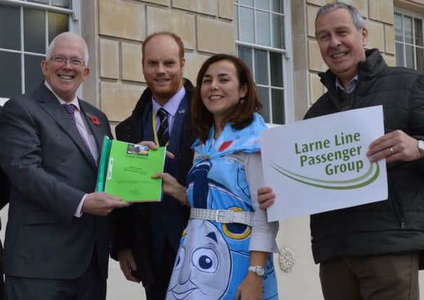 L-R MLA Stewart Dickson is pictured with Cllr Paul Sinclair, Chair of Larne Line Passenger Group Elena Aceves-Cully and LLPG member John Beresford at Stormont with the petition to reinstate the former Larne line rail timetable. INLT-45-711-con