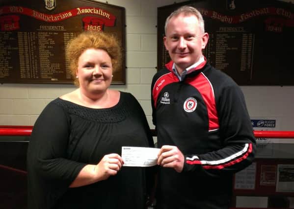 Peter Shepherd from Templepatrick Cricket Club presents a cheque to Natasha Lindsay. INLT 44-901-CON