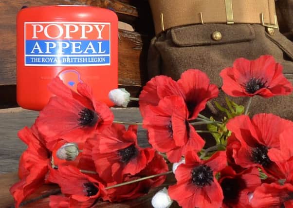 RBL collection tin and poppies.  Pic Colm Lenaghan/Pacemaker
