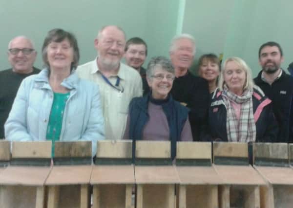 Glens Red Squirrel Group Members and Mid and East Antrim biodiversity    officer, Maurice Turnley, at the feeder workshop. INLT 45-802CON