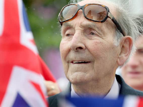 The late Bobby Platt watches the rowing events from the London 2012 Olympic Games in Coleraine town centre.  Picture Margaret McLaughlin