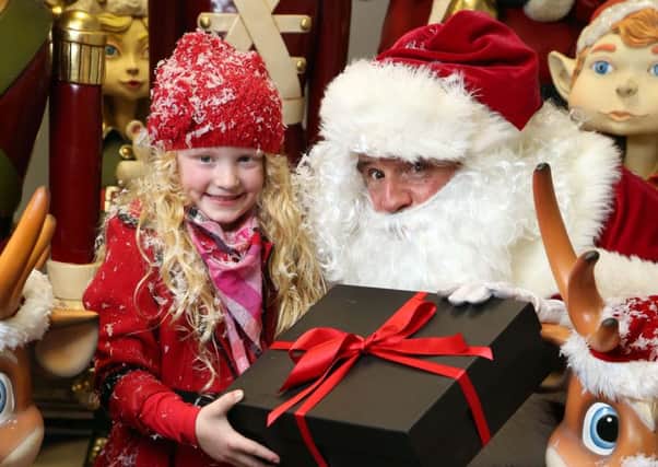 Maisie Hannath, 6, from Portadown, helps kick start Rushmere Shopping Centres festive fun before Santa flicks the switch on the centres Christmas lights on Thursday, November 12, at 6pm.