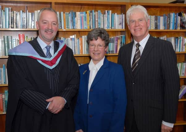 Mr Trevor Robinson, principal of Lurgan College and Mr Stanley Abraham, chairman of the Board of Governors welcome Dame Jocelyn Bell Burnell, guest of honour, to the school Speech Day. LM44-122gc