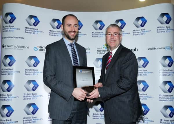 Simon Ballentine from AJ Power collects the category award for best Small Business in the Ulster Bank Business Achievers Awards 2015. Simon receives his award from Richard Donnan, Ulster Bank's Head of Northern Ireland.
