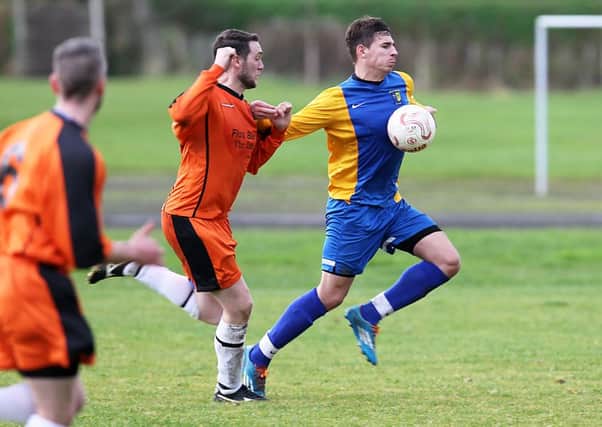 Eglinton's Tom Forrest chests the ball down and races through to score against Roe Rovers on Saturday. INLV4615-677KDR