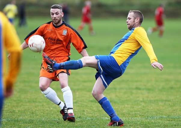 Roe Rovers Matty Hamilton and Eglinton's Ryan Barr in action on Saturday. INLV4615-593KDR